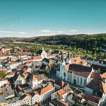 A beautiful aerial overview of Eichstätt, showcasing its historic architecture against a vibrant spring backdrop.